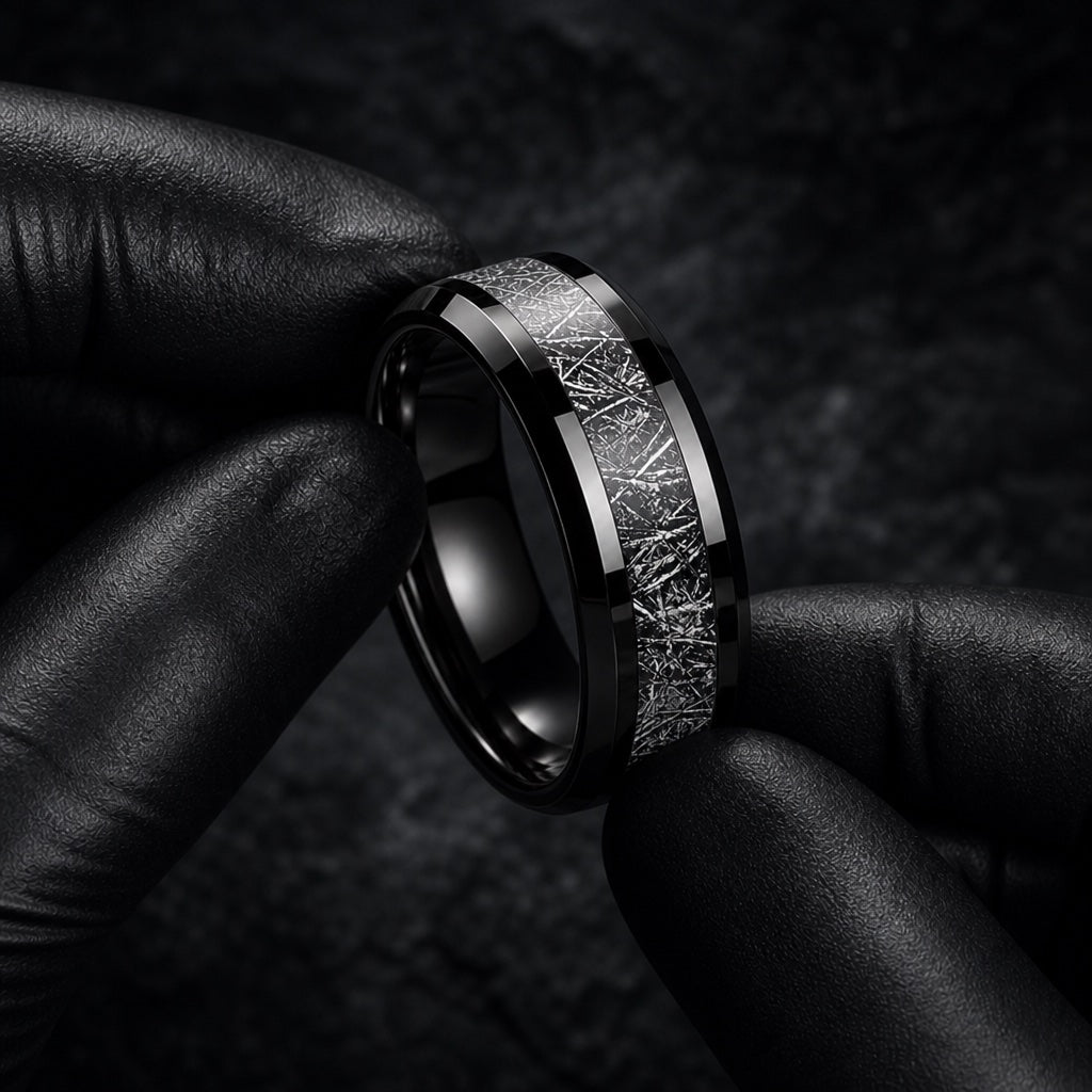 Gloved hands presenting the Astro ring, comfort-fit curve visible