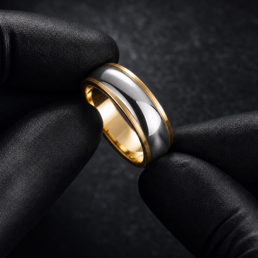 Gloved hands presenting the Aura ring, comfort-fit curve visible