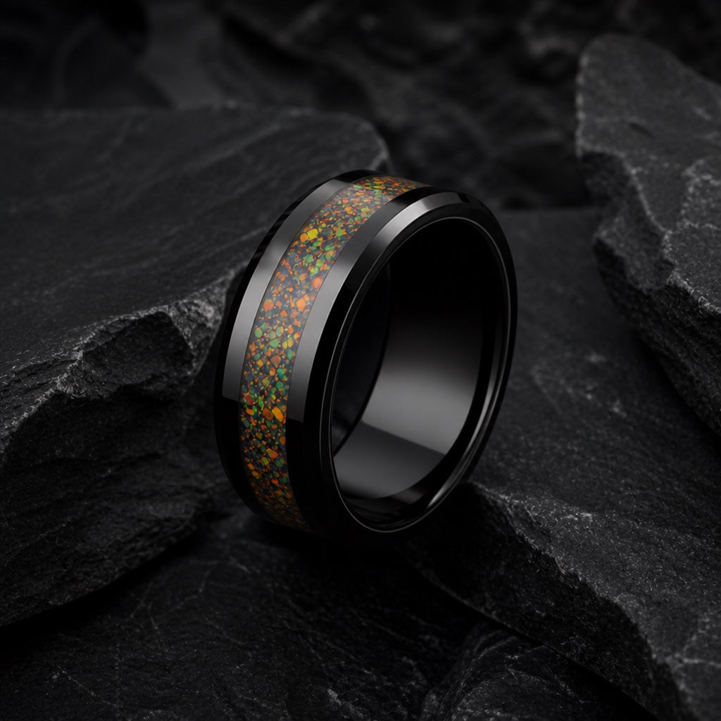 Divine ring angled on dark charcoal stone to show the blank polished black interior of the band with opal fire on the rim