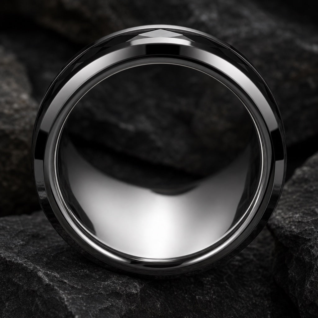 Immortal ring angled to show the blank polished silver interior of the band against dark stone