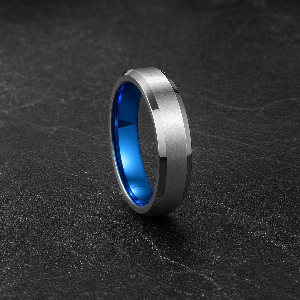 Jolt ring showing polished silver bevels against the brushed face on dark charcoal stone