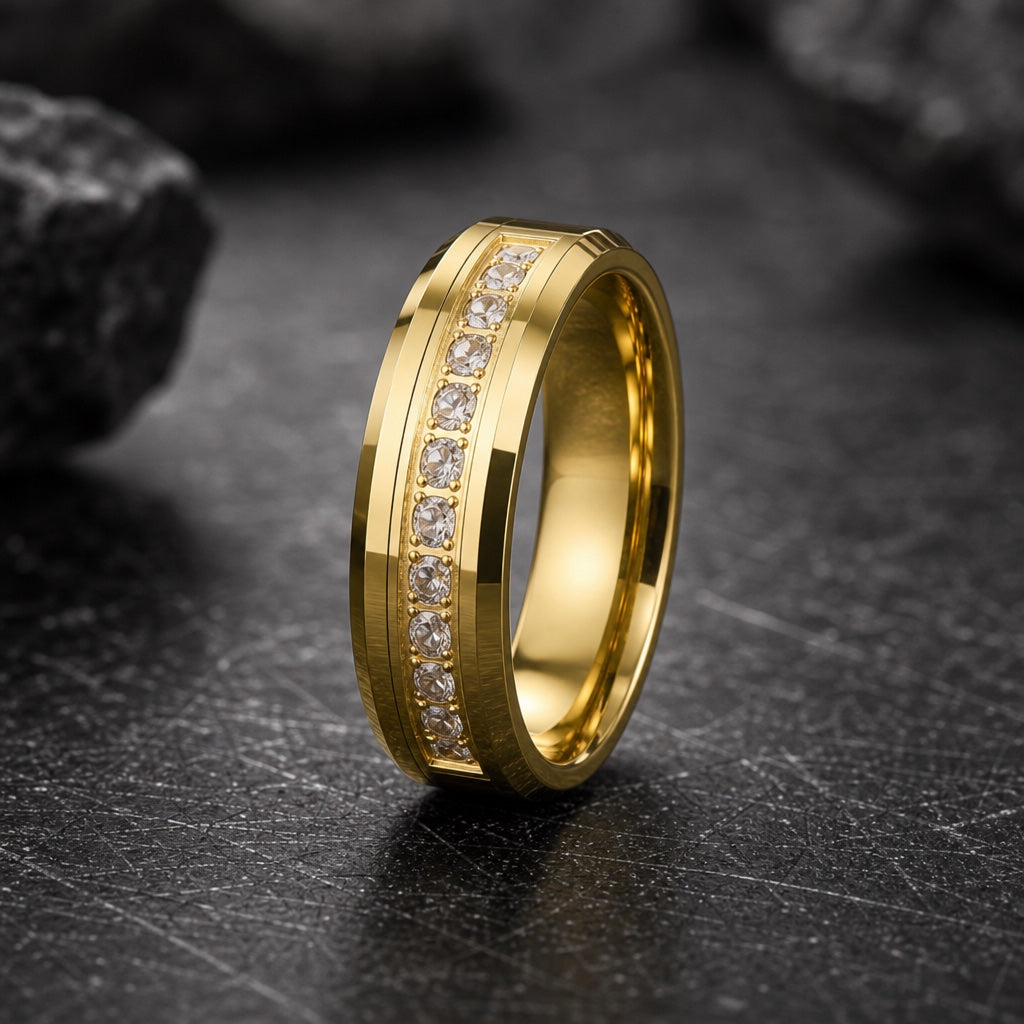 Luxury ring showing polished yellow-gold bevelled edges and centred clear CZ channel on dark charcoal rock