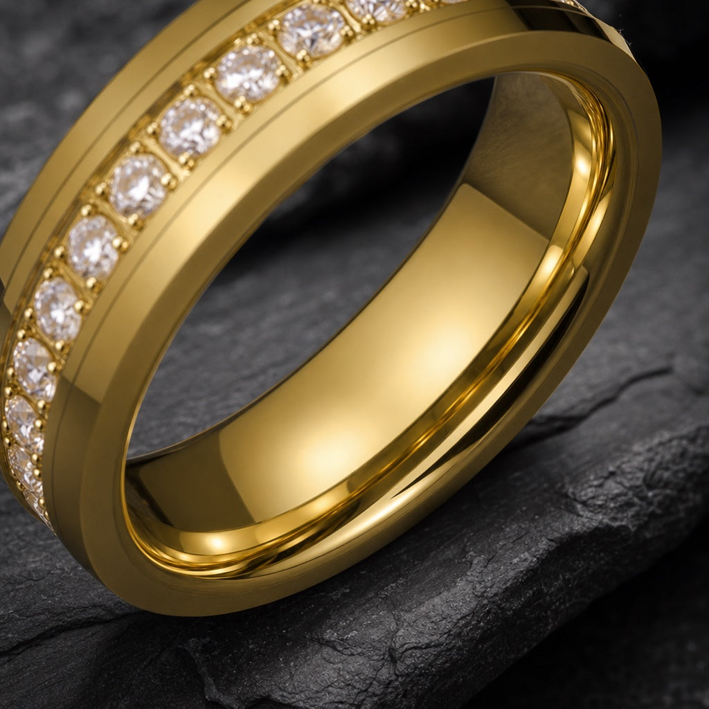 Luxury ring angled on dark charcoal stone to show the distinct polished yellow-gold interior of the band