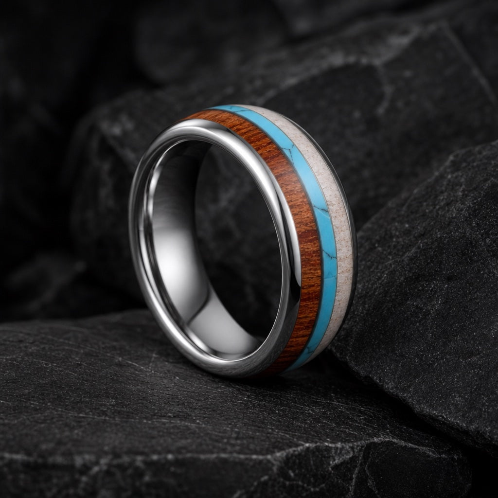 Mana ring angled on dark charcoal stone to show the blank polished silver interior of the band