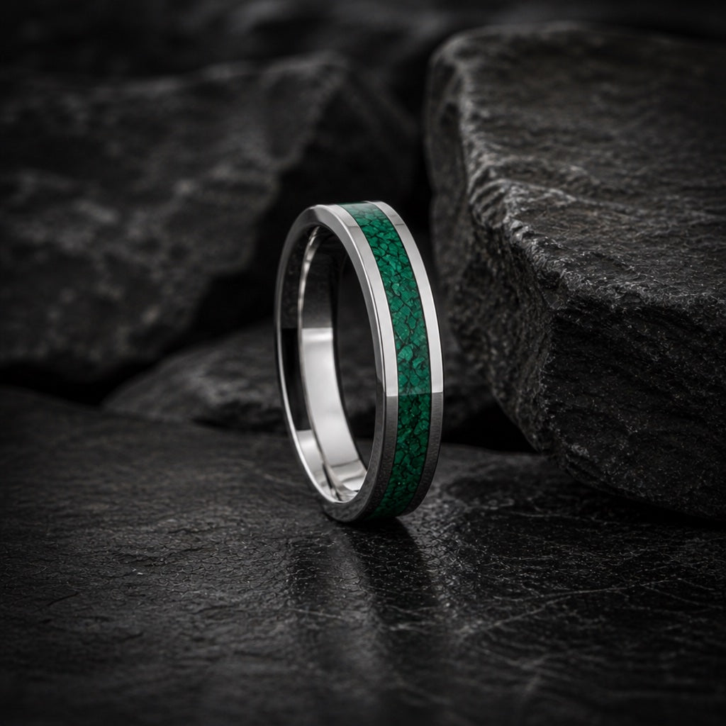 Oracle ring full band on dark charcoal rock with malachite channel visible