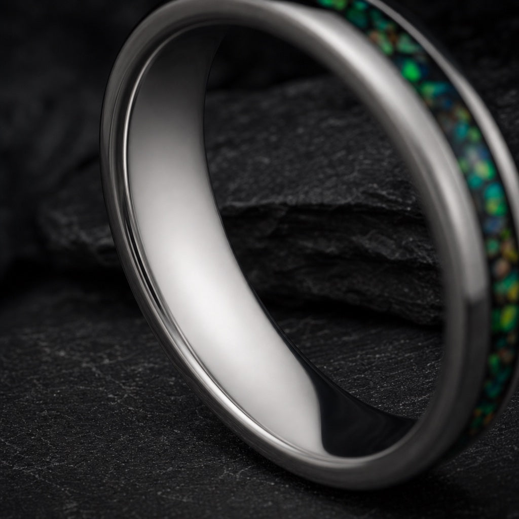 Saint ring angled to show blank polished silver interior on dark stone