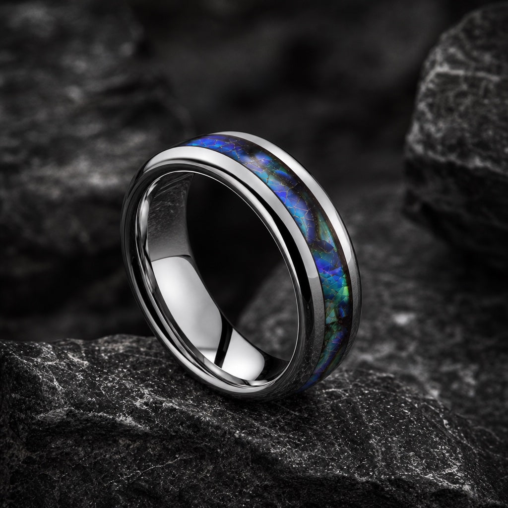Shaman ring angled on dark stone to show blank polished silver interior