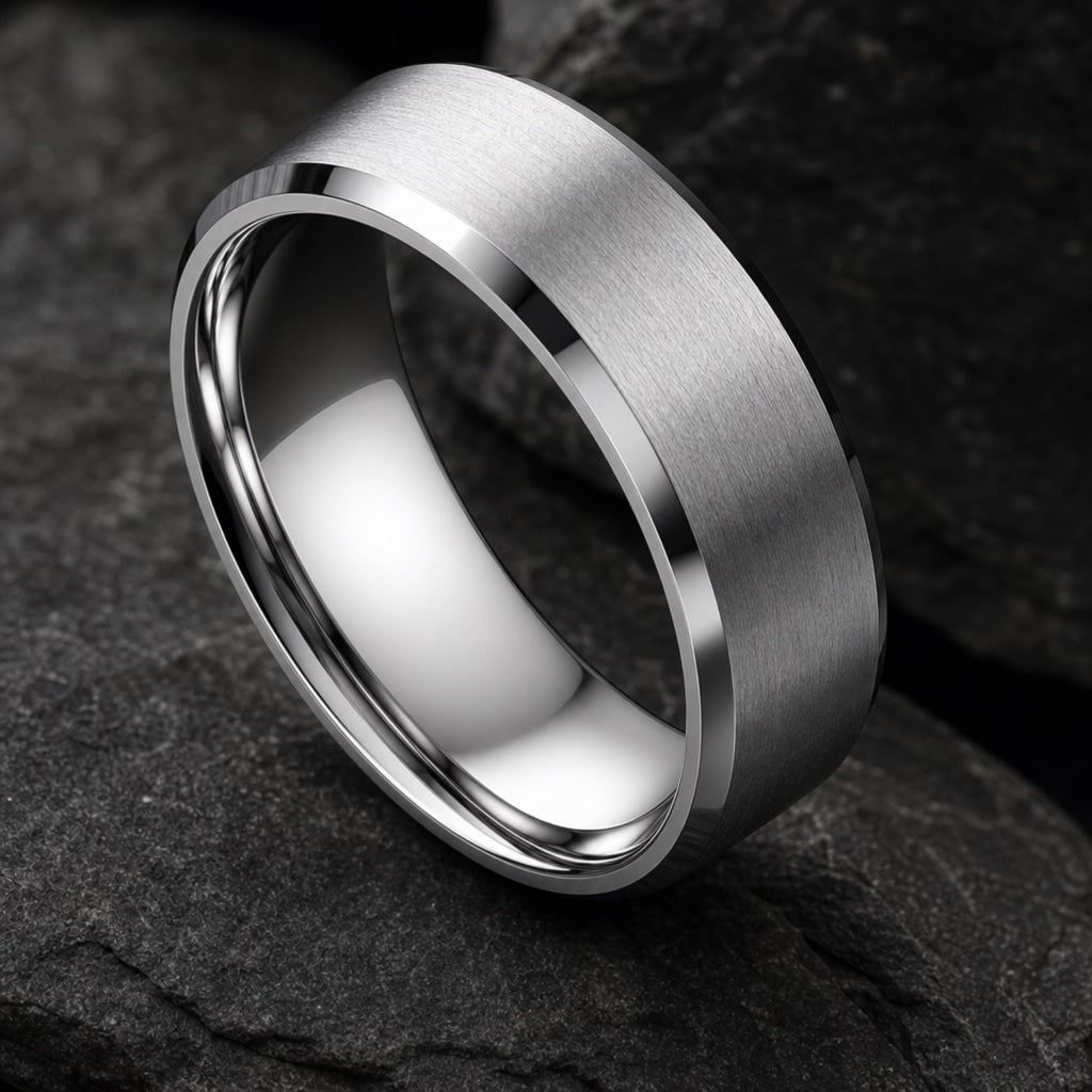 Sterling ring angled on dark charcoal stone to show the polished blank silver interior