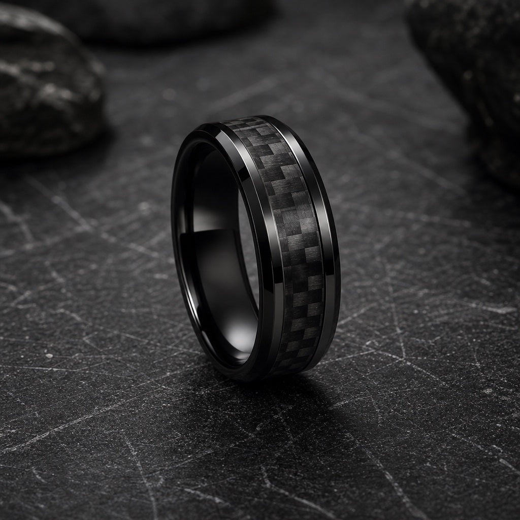 Turbo ring showing polished black bevelled outer rails against the centred carbon-fibre weave on dark stone