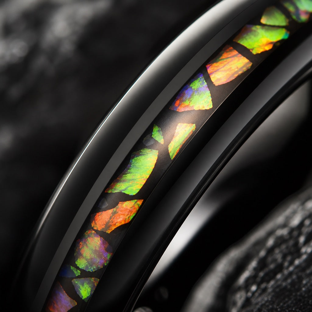 Macro of the Angel ring's centred crushed opal and abalone inlay on polished black