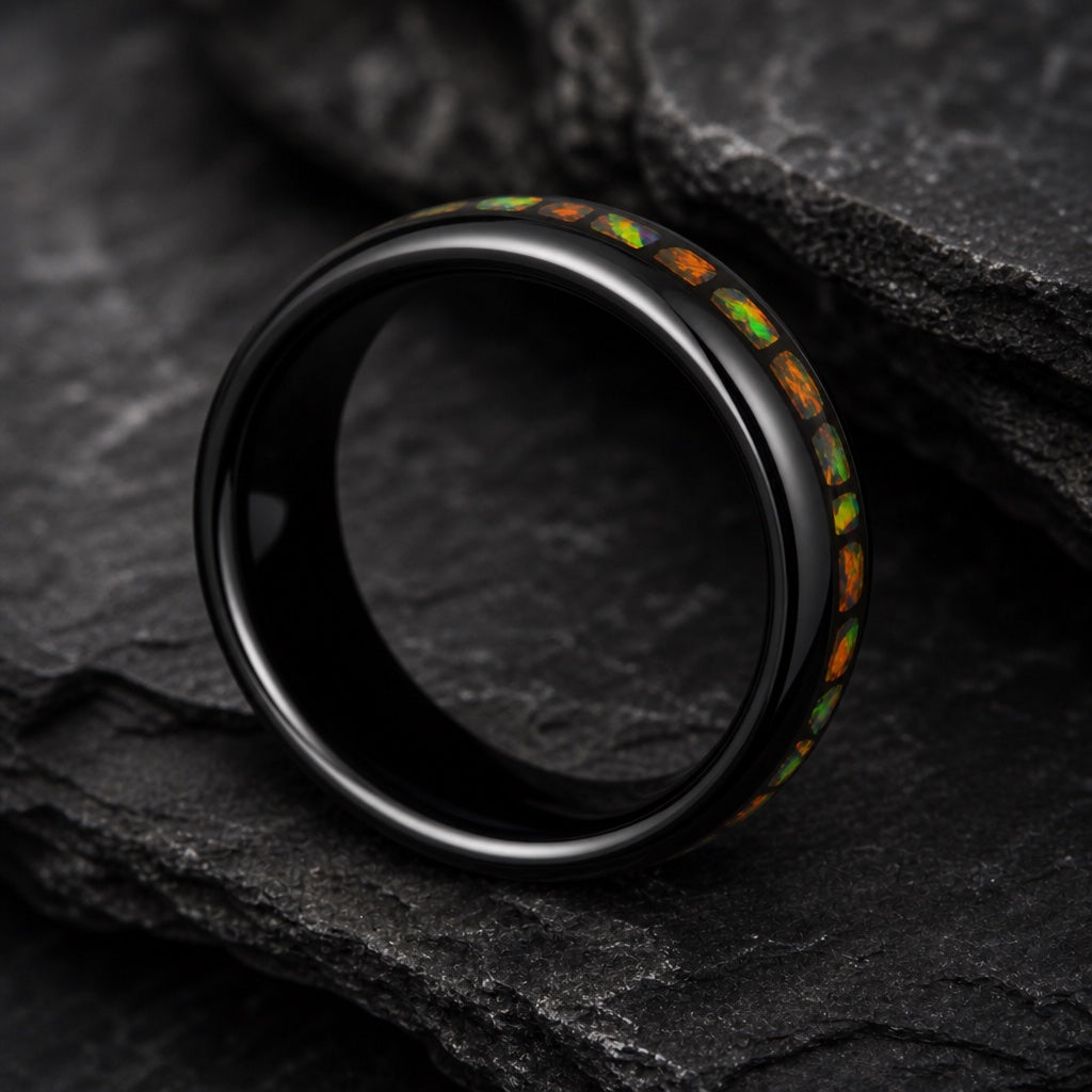 Angel ring angled on dark stone showing blank polished black interior
