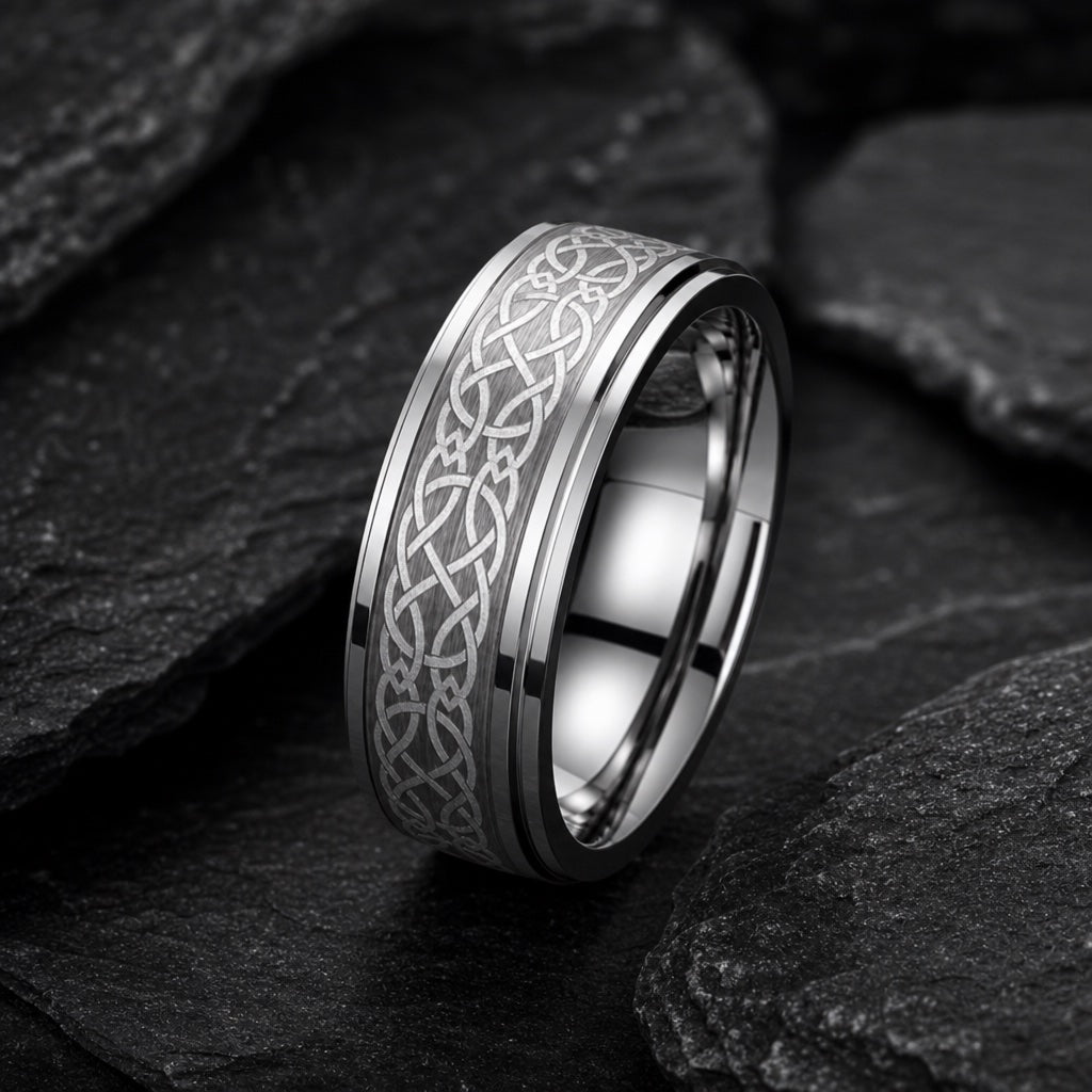 Celtic ring showing Aura-style stepped rails and knot face