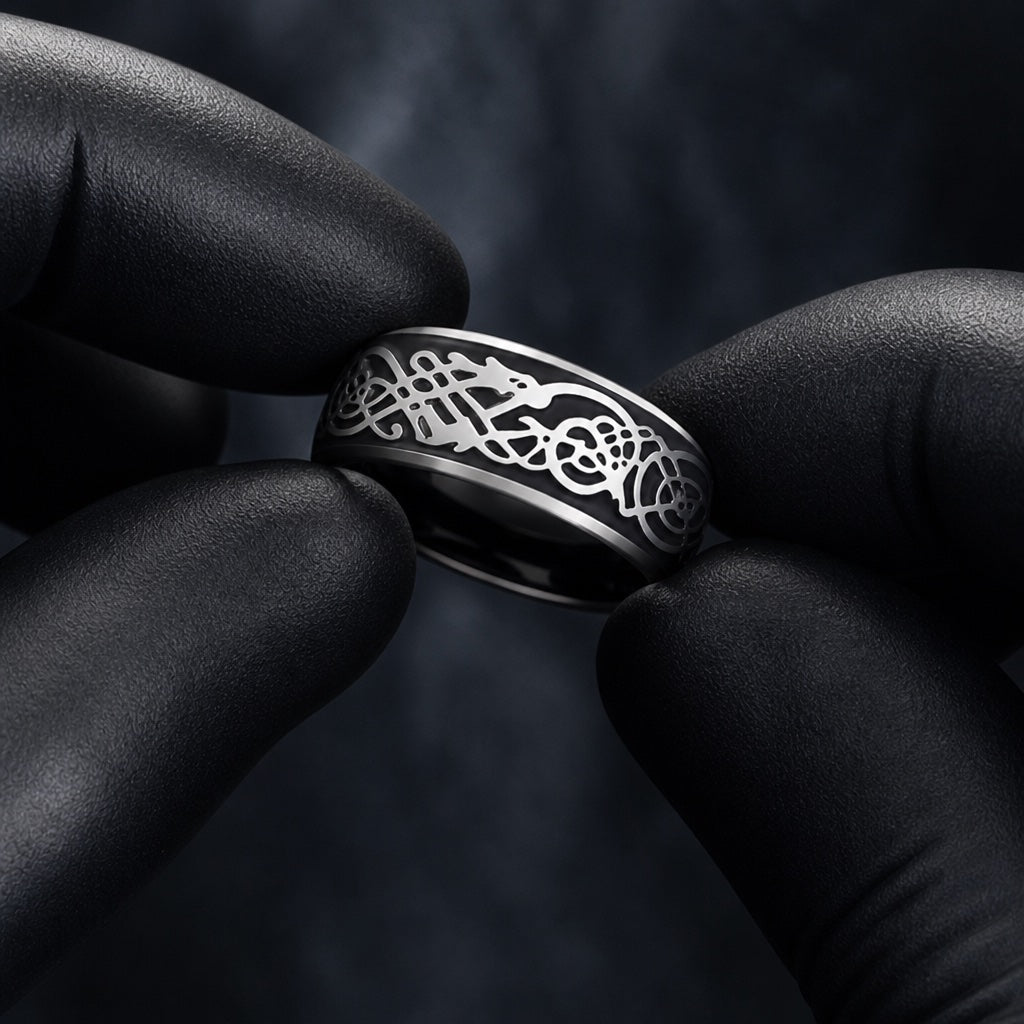 Gloved hands presenting the Drago ring, comfort-fit curve and raised silver dragon relief visible