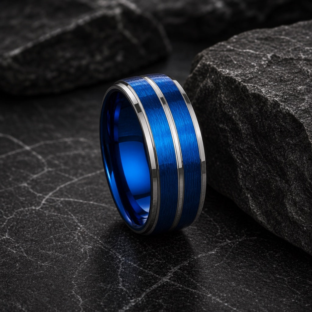 Dynamo ring showing polished silver stepped outer edges against dark stone
