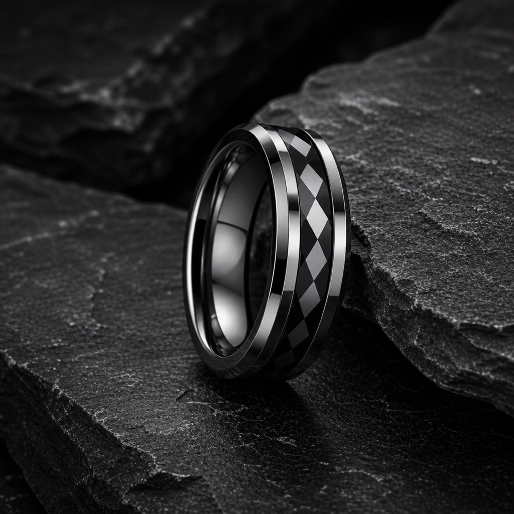 Immortal ring showing polished silver and black bevelled outer rails against the geometric channel
