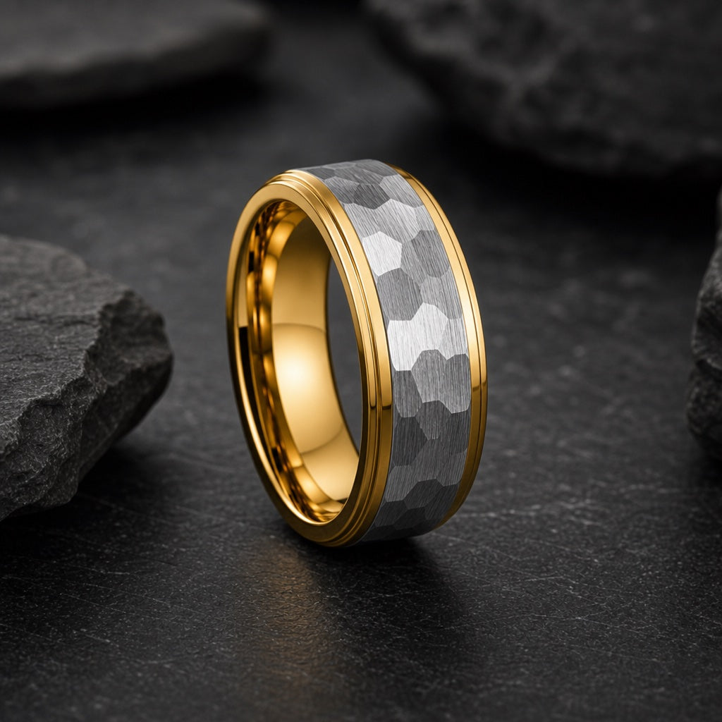 Lustre ring showing polished yellow-gold Aura-style stepped edge rails against the hammered silver centre