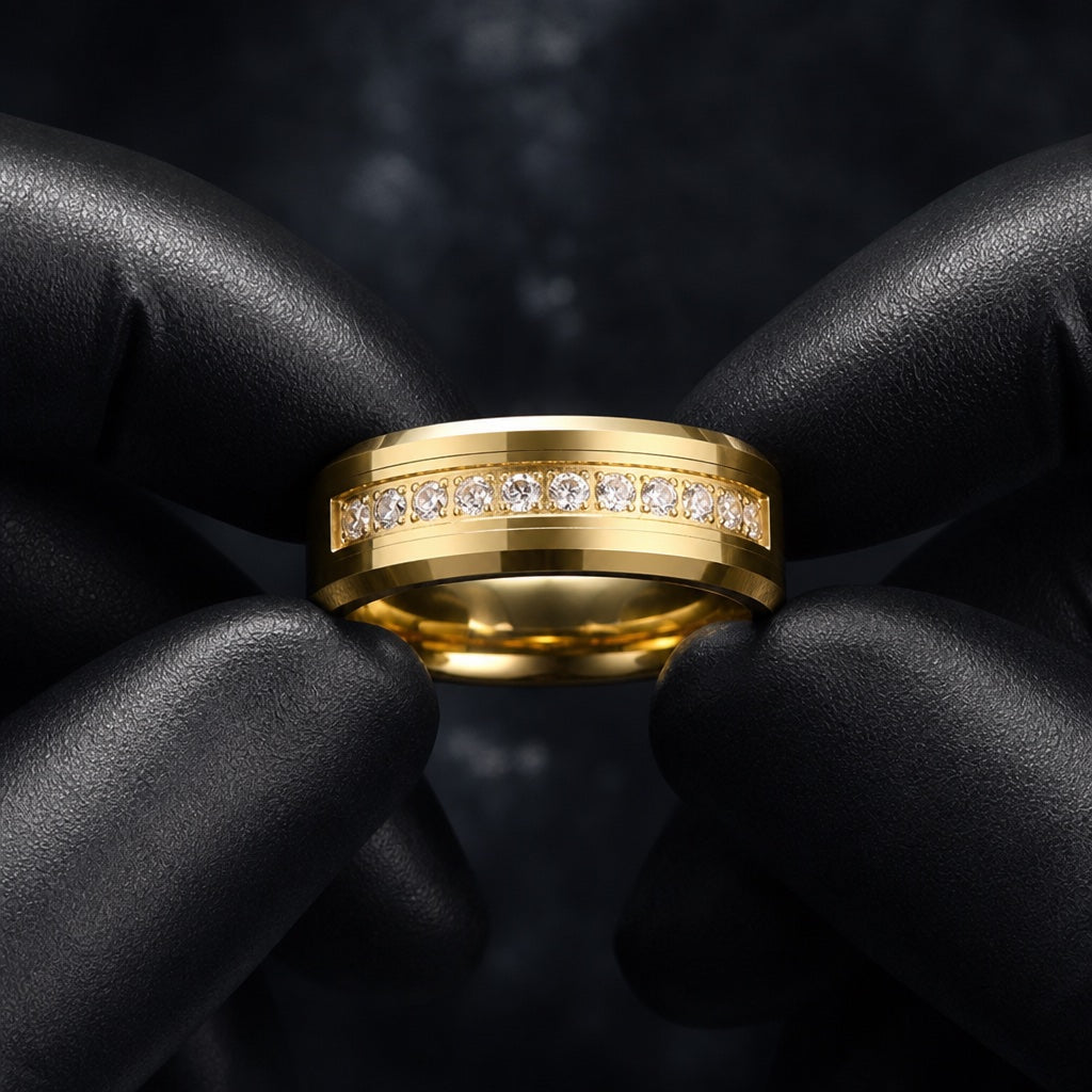Gloved hands presenting the Luxury ring, polished yellow gold bevels and centred clear CZ channel visible