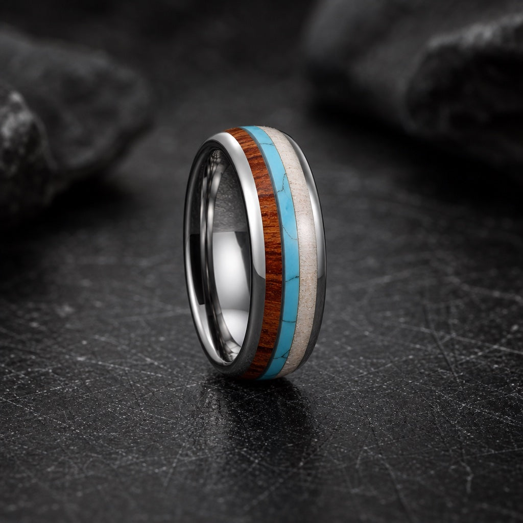 Mana ring showing round soft-dome silver edges and three centred natural inlays on dark stone