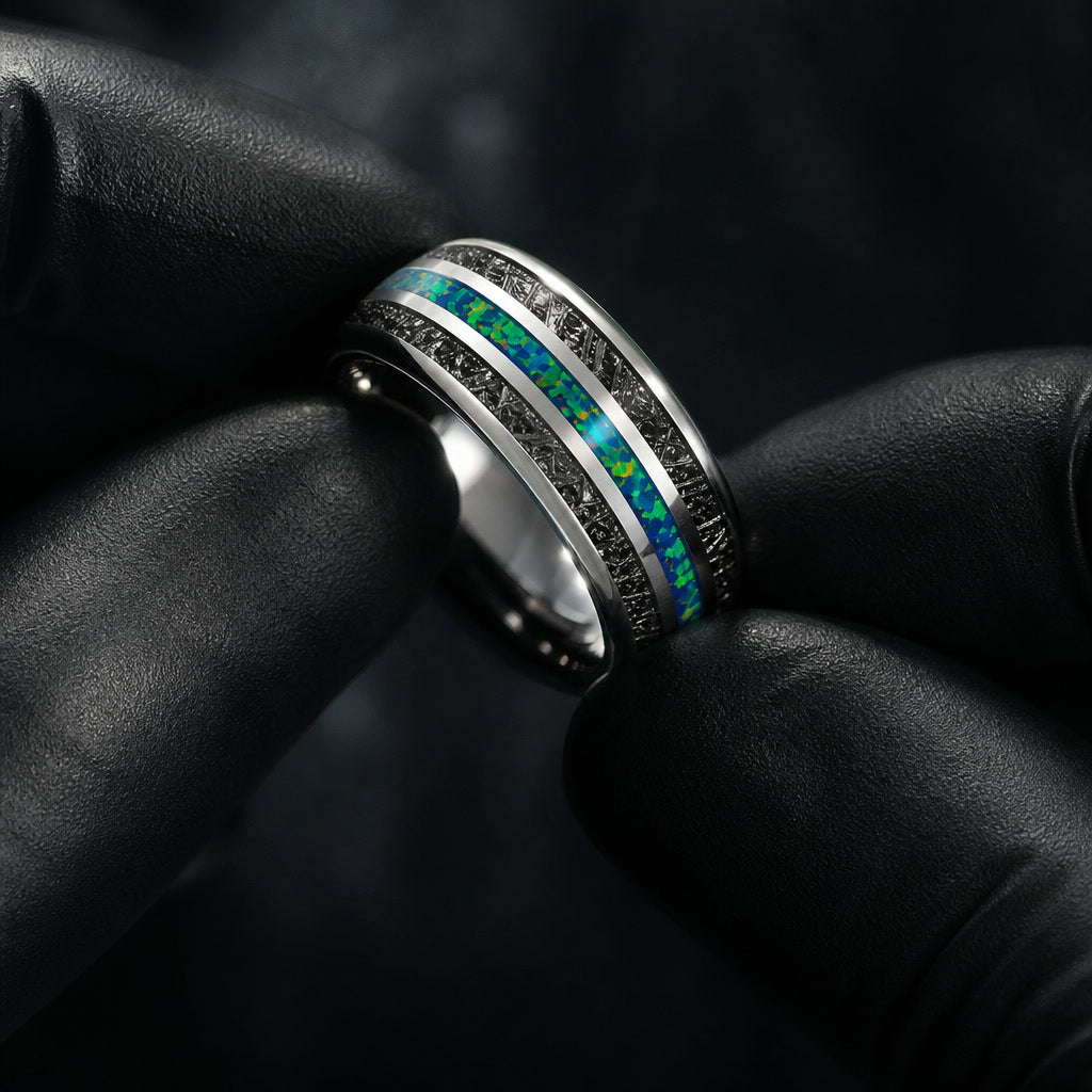 Gloved hands presenting the Nebula ring, interior curve visible