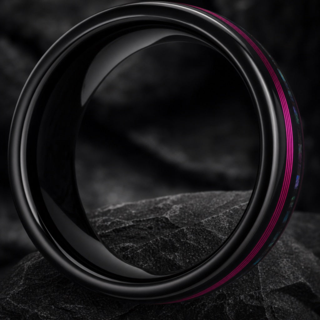 Neon ring angled on dark charcoal stone to show the blank polished black interior of the band