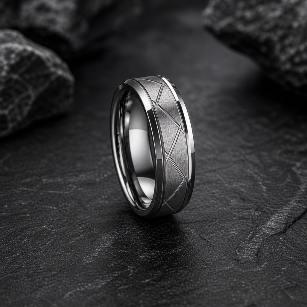 Pioneer ring showing brushed gunmetal face and polished bevelled outer rails on dark charcoal stone