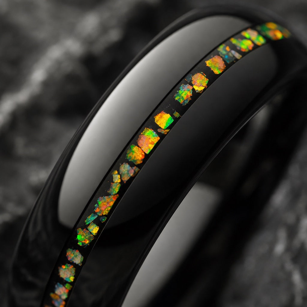 Macro of the Seraph ring thin centred crushed opal fire channel on dark charcoal stone