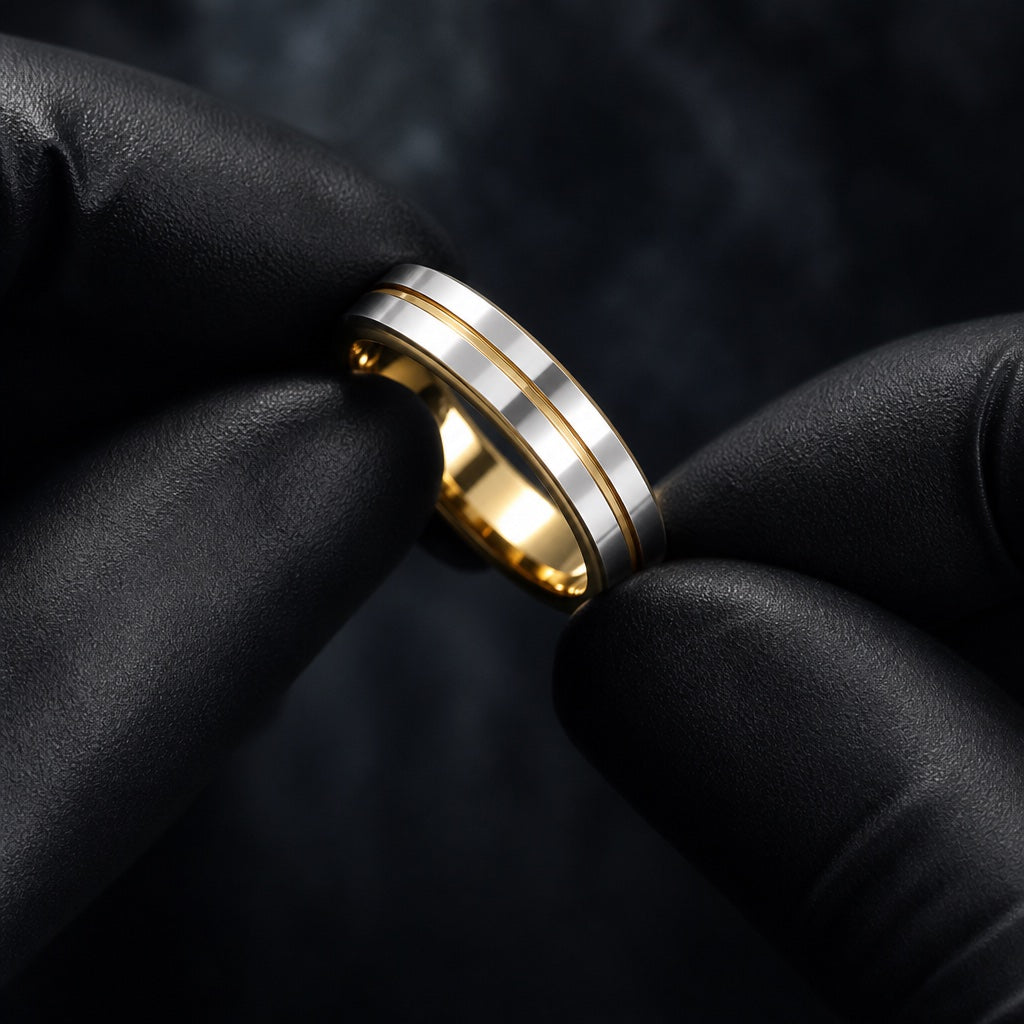 Gloved hands presenting the Shine ring, twin silver rails and thin gold centre line visible