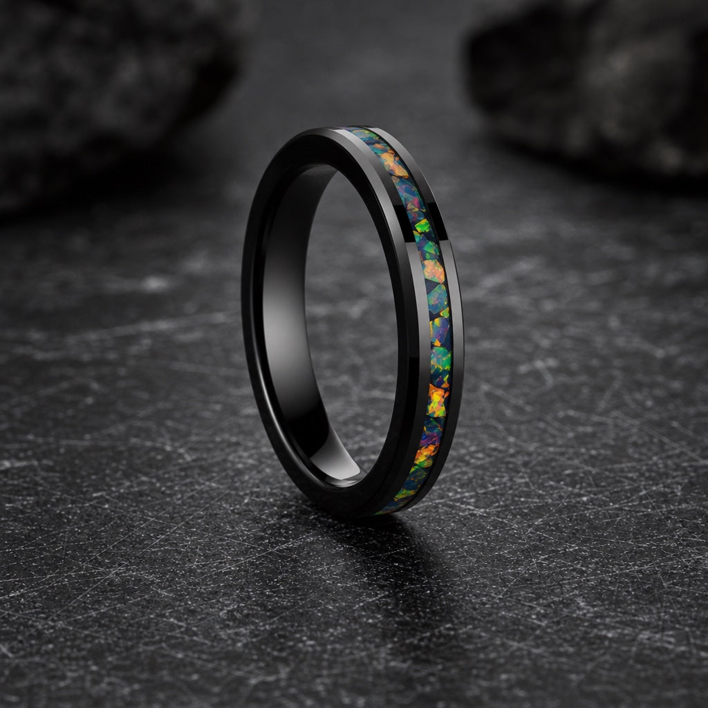 Spirit ring showing flat pipe-cut polished black profile and centred opal channel against dark stone