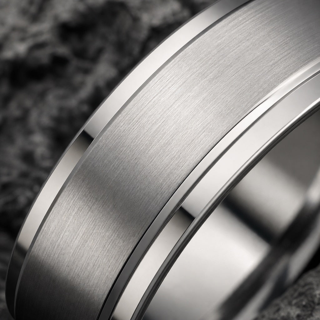 Macro of the Vanquish ring raised brushed silver centre face on dark charcoal stone